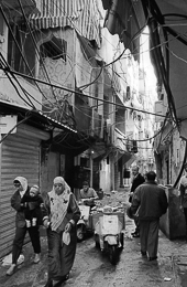 Architecture;Buildings;Cables;Kaleidos-images;Mopeds;Palestinian-Refugees;Palestinians;People;Refugee-camps;Shatila;Shops;Streets;Tarek-Charara;UNRWA;Alley