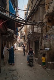Architecture;Buildings;Cables;Kaleidos-images;Mopeds;Palestinian-Refugees;Palestinians;People;Refugee-camps;Shatila;Shops;Streets;Tarek-Charara;UNRWA;Alleys