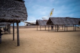 Barakah,-L1011-TriStar,-Lockheed-L1011,-abandoned-TriStar,-aircraft-wreck,-grounded-aircraft,-white-fuselage,-derelict-cockpit,-empty-cabin,-Cotonou-beach,-Cadjéhoun-beach,-Cotonou-Benin,-West-Africa,-Benin-airport,-Atlantic-coastline,-coastal-Benin,-corroded-wreck,-marine-rust,-deterioration,-salt-corrosion,-decay,-abandonment,-dereliction,-dilapidation,-environmental-erosion,-aviation-heritage,-industrial-archaeology,-failed-tourism-project,-open-air-museum,-urban-art,-colonial-relic,-Benin-history,-alternative-tourism,-architectural-curiosity,-aviation-history,-hajj-pilgrimage,-Air-Rum-airline,-defunct-carrier,-humanitarian-transport,-international-migration,-historical-traces,-industrial-heritage,-stranded-aircraft,-tourist-attraction,-urban-exploration,-ruin-photography,-beach-adventure,-Beninese-leisure,-amusement-park,-immersive-experience,-urban-safari,-overcast-sky,-sunset-beach,-tropical-storm,-coastal-erosion,-sea-salt,-Atlantic-Ocean,-white-sand,-coastal-vegetation,-gleaming-white,-nature-machine-contrast,-aerospace-geometry,-outstretched-wings,-empty-windows,-cabin-stairway,-cockpit-instruments,-time-displacement,-obsolescence,-suspended-time,-liminality,-aborted-transformation,-urban-memory,-unfinished-dream,-nature-industry-symbiosis,-tourism-ghost,-frozen-history