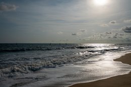Atlantic-Ocean;-Benin;-Coastline;-Cotonou;-Fidjrossè;-Gulf-of-Guinea;-Kaleidos;-Kaleidos-images;-La-parole-à-limage;-Late-afternoon;-Reflection;-Rough-sea;-Route-des-Pêches;-Sailing-boat;-Silvery-hue;-Stories-Pictures;-Tarek-Charara;-West-Africa;-Wet-sand