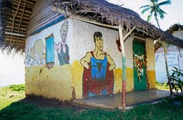 Archipel-des-Comores;-Architecture;-Case;-Cocotier;-France;-Kaleidos;-Kaleidos-images;-La-parole-à-limage;-Laurent-Abad;-Mayotte;-Océan-Indien;-Peinture-murale;-Personnages;-Stories-Pictures;-Toit-de-chaume;-Vie-quotidienne